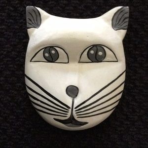 Cat face brooch.